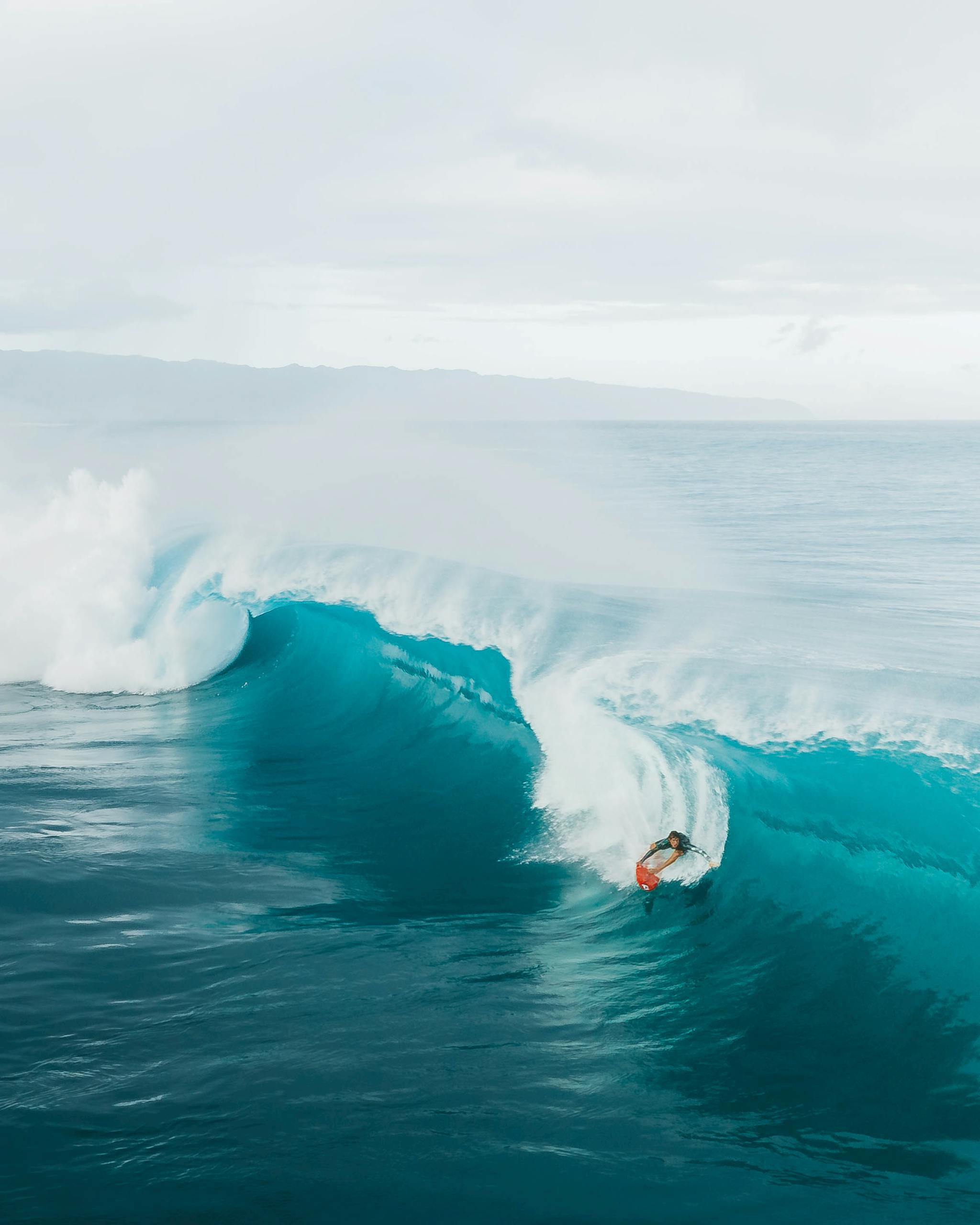 Person Surfing on Sea Waves